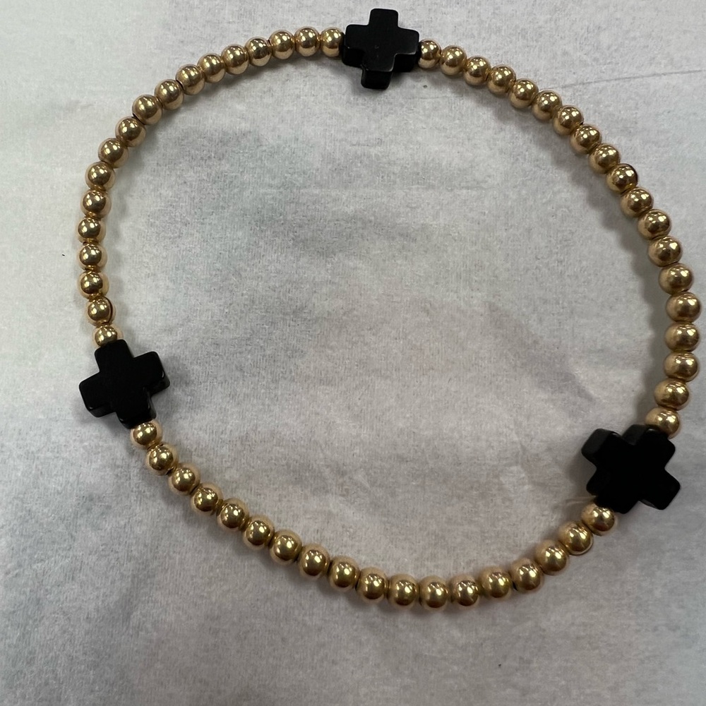 E newton black and gold bracelet
